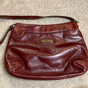 Red leather purse. Etienne Agner